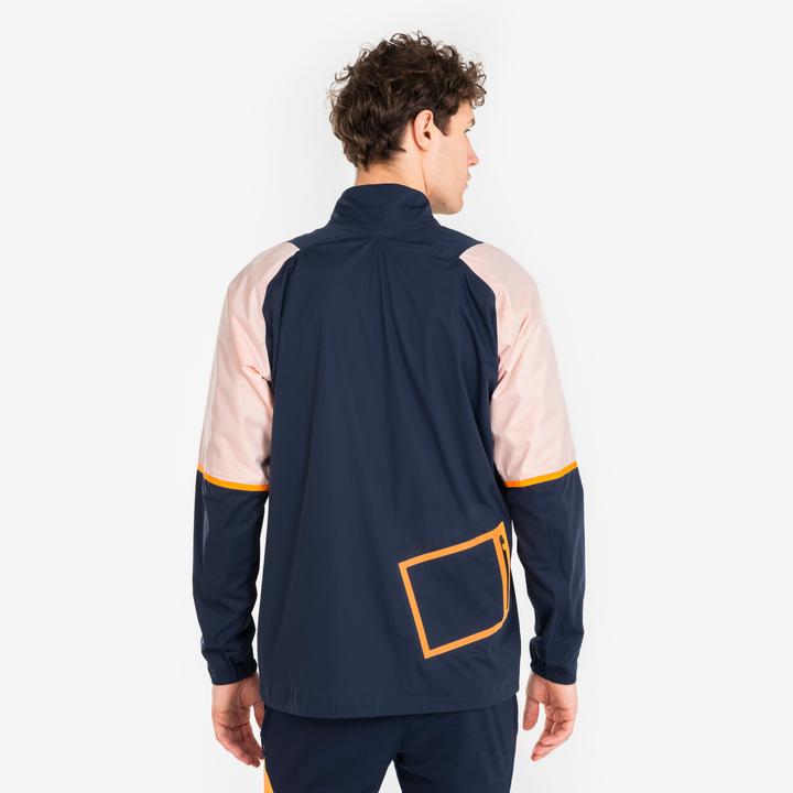 Immagine prodotto Kipsta Giacca da calcio antipioggia da donna/uomo - CLR blu navy/arancio (XS)