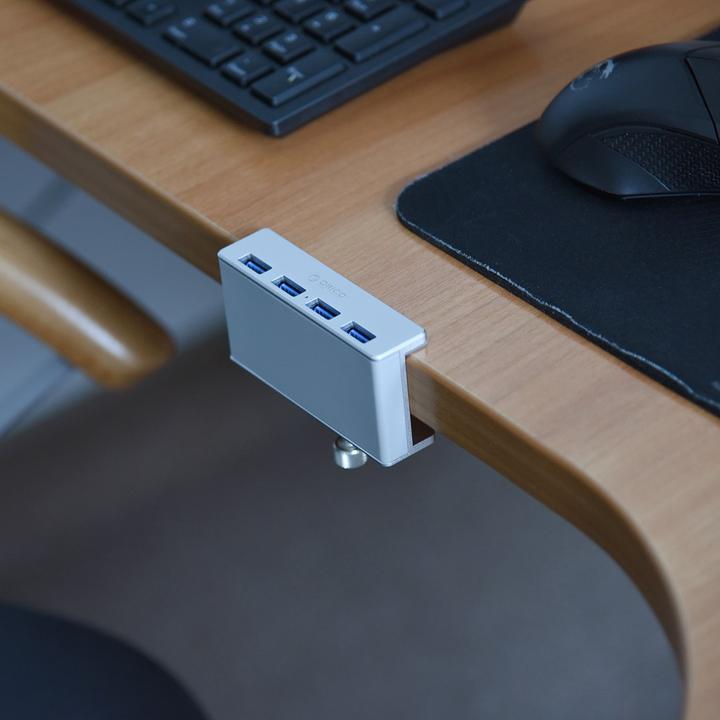 Produktbild Orico MH4PU-P-SV-BP (USB-C, 4 Ports)