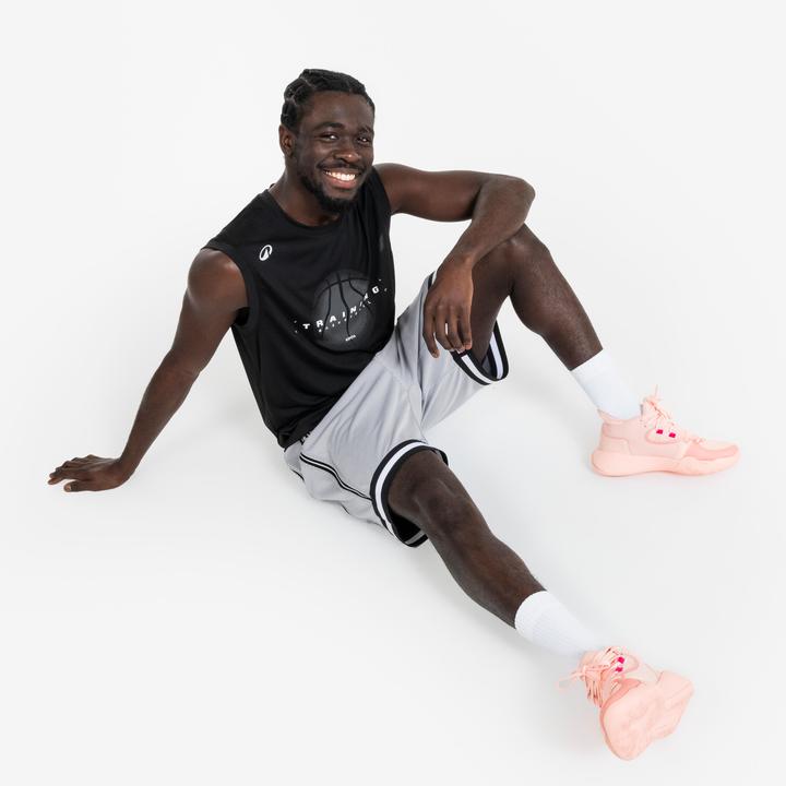 Actual product image Kipsta Damen/Herren Basketball Trikot ärmellos - Fast 500 schwarz (XS)