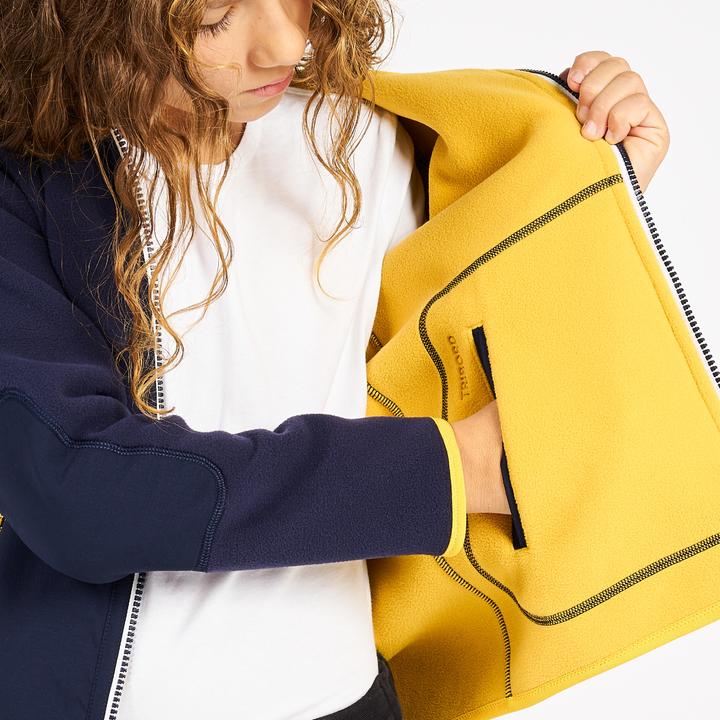 Immagine prodotto Tribord Giacca in pile da vela per bambini calda e reversibile 500 blu navy/giallo (164)