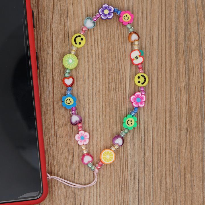 Immagine prodotto PhoneLook Bijou de téléphone universel / Bracciale pendente con charms Fleurs e emojis perles
