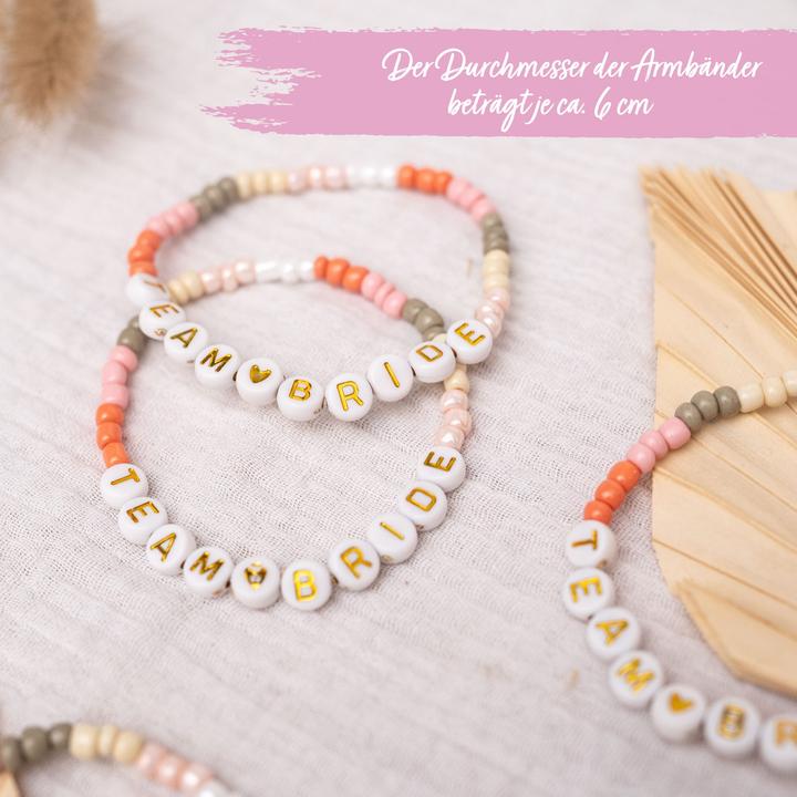 Immagine prodotto Papierdrachen 4 Perlenarmbänder Brautjunfer – TEAM <3 BRIDE (Materiale sintetico, Gomma, Tessuto)
