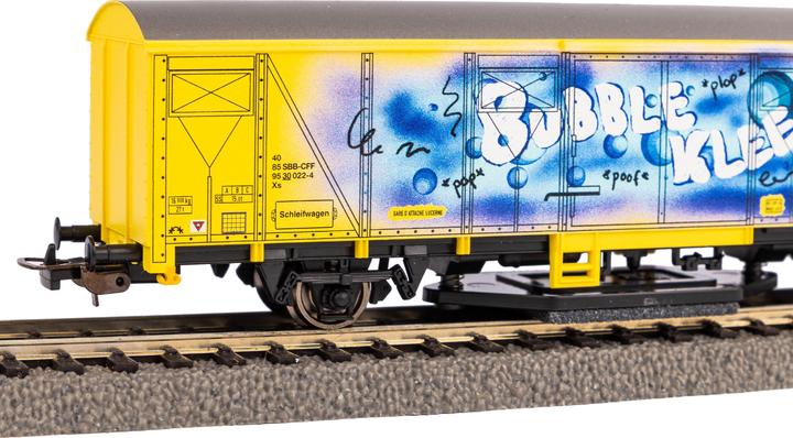 Actual product image Piko H0 54309 H0 Rail cleaning wagon yellow with SBB graffiti (Track H0)