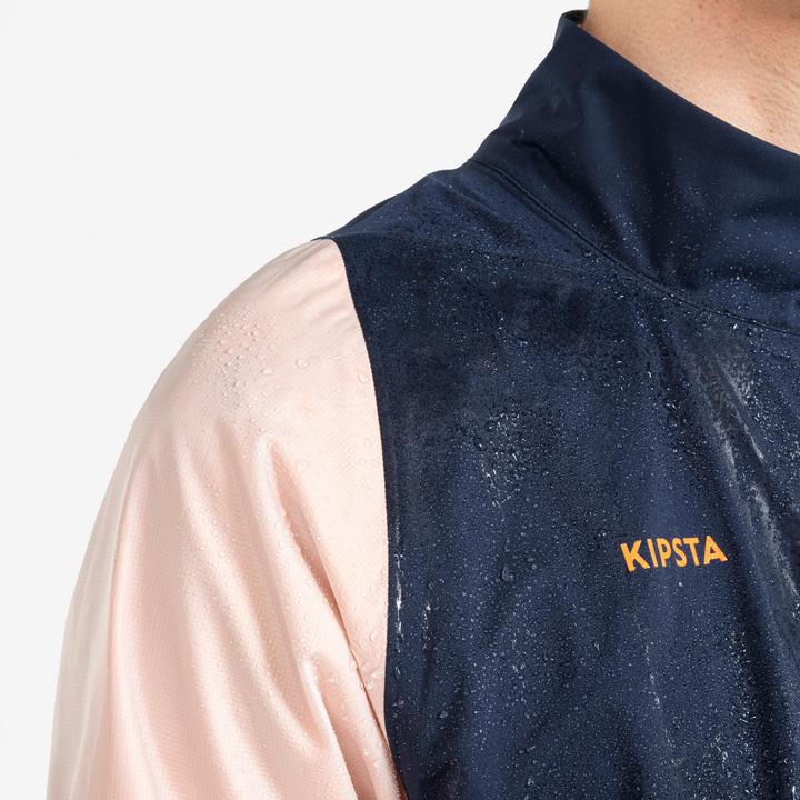 Immagine prodotto Kipsta Giacca da calcio antipioggia da donna/uomo - CLR blu navy/arancio (XS)