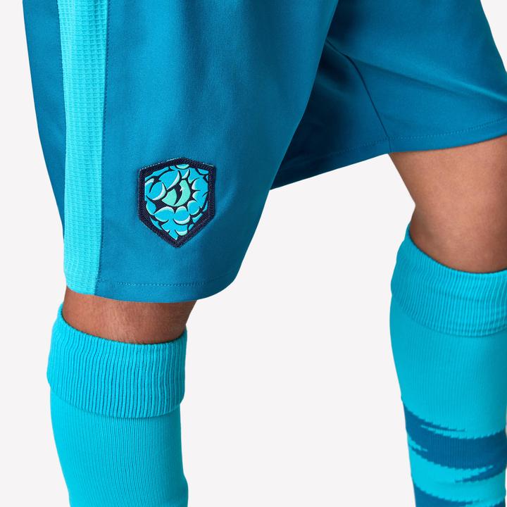 Actual product image Kipsta Kinder Fussball Shorts - VIRALTO Kids türkis mit grünem Streifen (122)