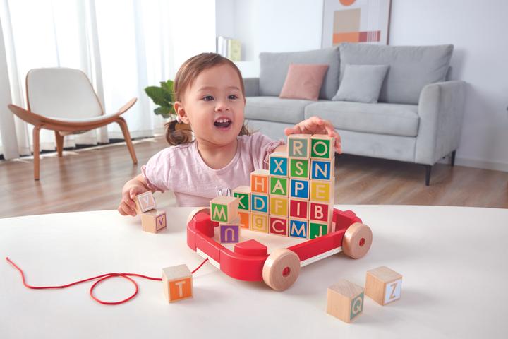 Actual product image Hape Letter blocks in the pull-along trolley