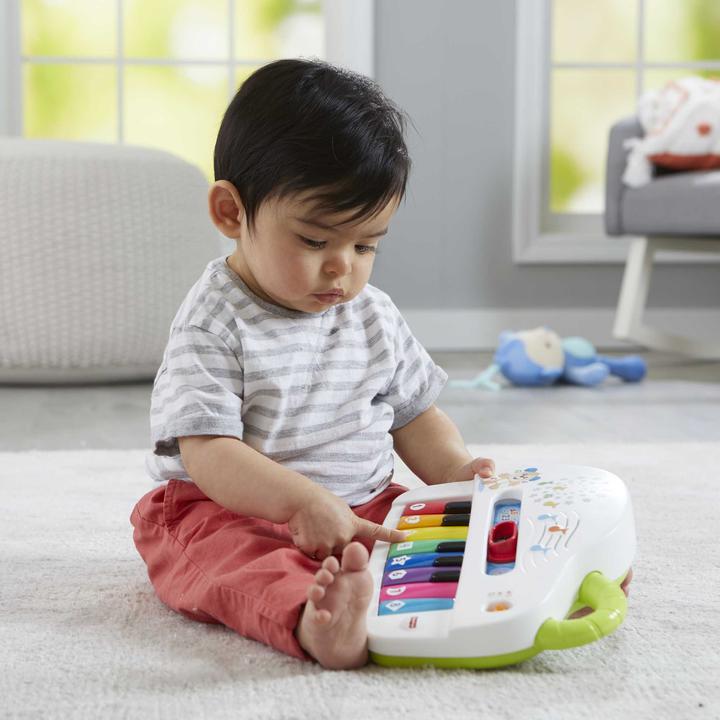 Actual product image Fisher-Price Doggy Piano Laugh & Learn Multilingual Edition, Portable with Lights, Verses d