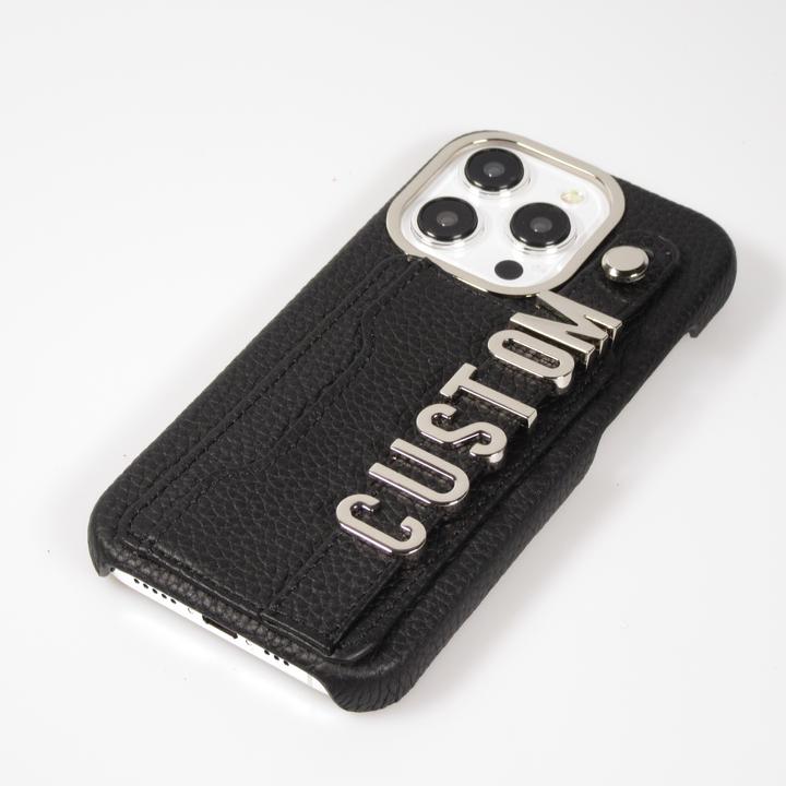 Immagine prodotto PhoneLook Copertina Copertina in pelle personalizzata con scritte in argento + cordino e scomparto per le (Apple iPhone 15 Pro Max)