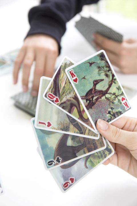 Actual product image Kikkerland 3D Dinosaur Playing Cards (French, German, Portuguese, English, Spanish, Italian, Icelandic)
