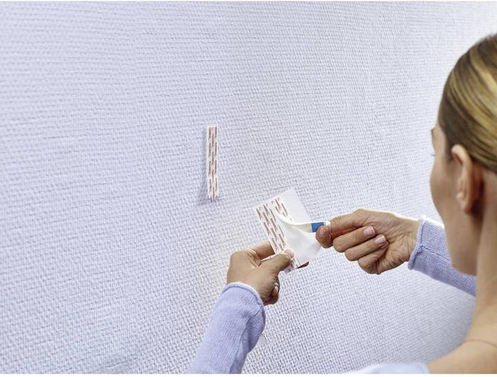 Produktbild tesa 3x Powerstrips für Tapete & Putz, 1kg Halteleistung, 18 doppelseitige Klebestreifen