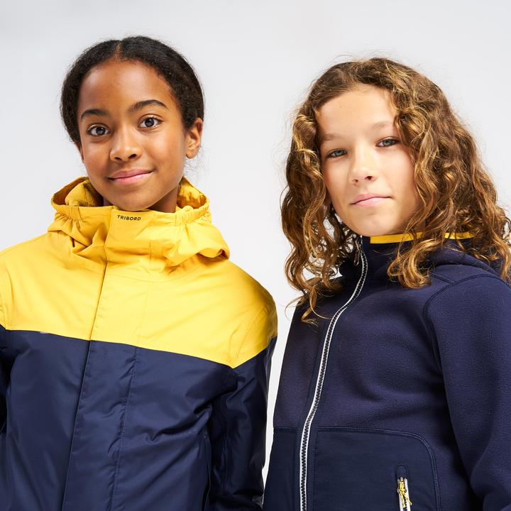Immagine prodotto Tribord Giacca in pile da vela per bambini calda e reversibile 500 blu navy/giallo (164)