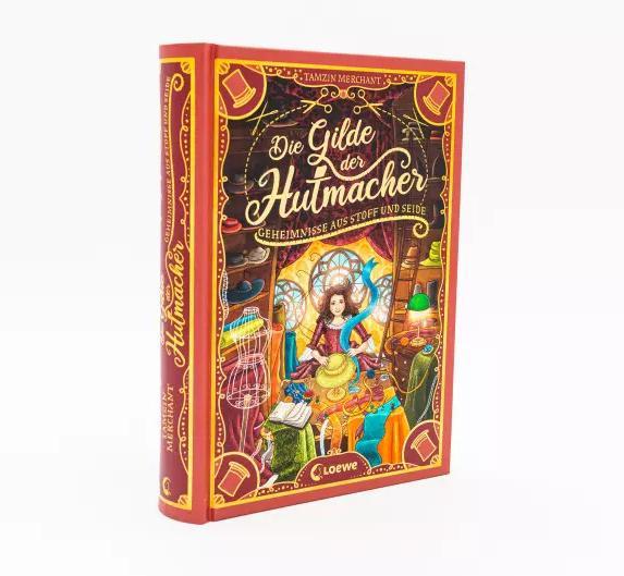 Produktbild Die Gilde der Hutmacher (Die magischen Gilden, Band 1) - Geheimnisse aus Stoff und Seide (Deutsch, Tamzin Merchant, Paola Escobar, Nadine Mannchen, Loewe Kinderbücher, 2022)