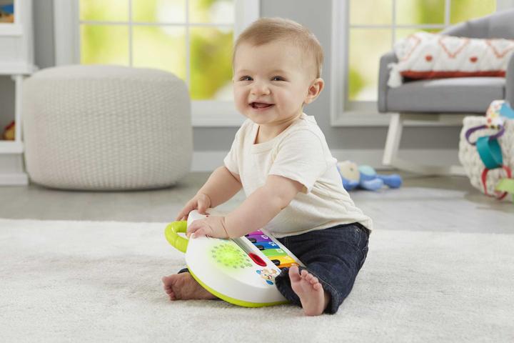 Actual product image Fisher-Price Doggy Piano Laugh & Learn Multilingual Edition, Portable with Lights, Verses d