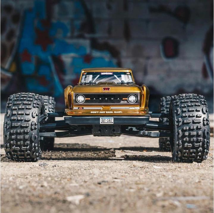 Produktbild Arrma Monster Truck Outcast 4x4 V2 BLX 4S, Bronze 1:10, ARTR (ARR Almost-Ready-to-Race)