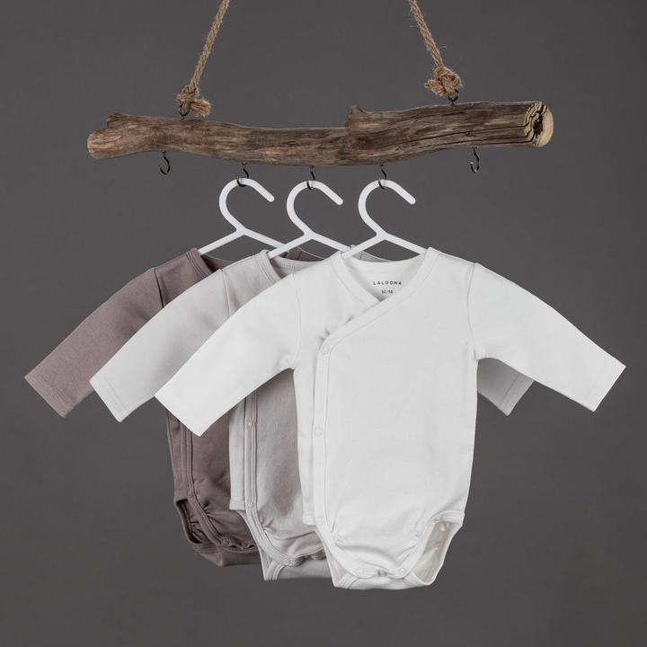 Actual product image Alvi Baby nest & bed snakes 8-piece slumber set - nest + 3 bodysuits +